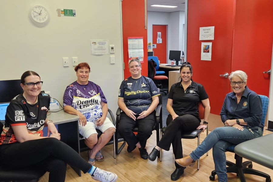 Healthy Ageing Clinic staff providing specialised care to Aboriginal Elder (second from right).