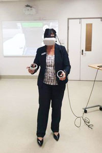 Tami Photinos using the VR system at TPCH