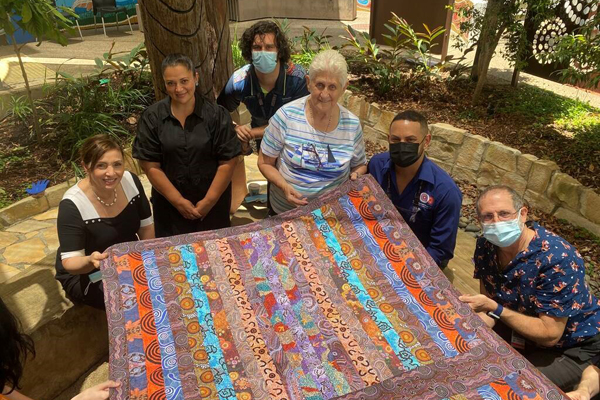 Aunty Jeanette Kelly showing one of her quilts