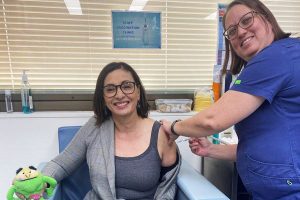 Tami Photinos receiving her flu vaccination