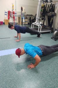 Physiotherapy staff involved in push ups challenge in the TPCH gym