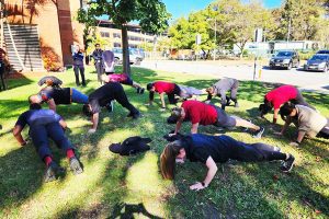 Physiotherapy staff involved in the push up challenge outdoors at TPCH