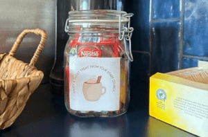 Glass jar of hot chocolate sachets provided by the STARS Staff Council 