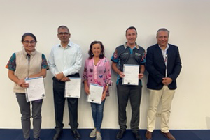 Oral Health Staff Development Day participants holding their awards