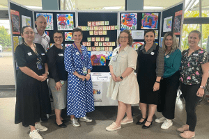 Child Protection Unit team standing in front of their display at TPCH