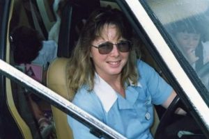 Helen Corrie sitting in a car at Redcliffe Hospital in 1989