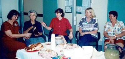 Helen Edwards seated in the middle of this staff photo at Caboolture Hospital