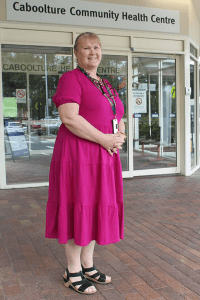 Tania Stewart, a Facility Manager, standing in front of entrance to Caboolture Community Health Centre