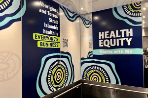 Health Equity artwork on walls of Block 7 lift