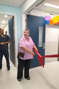 Rose Cooper cutting ribbon at opening of Intensive Care Unit