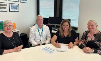 Metro North and the Brisbane North PHN staff signing the extension of the Health Alliance