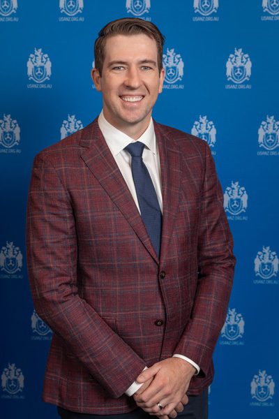 Upper body photo of Dr Matthew Roberts a researcher at RBWH wearing a burgundy coloured suit