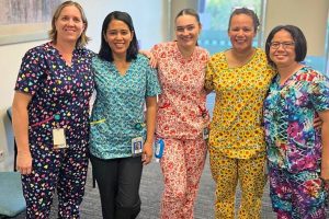 Community palliative care team based at North Lakes wearing brightly-coloured scrubs