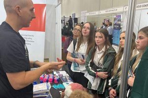 Student watching on at Health Careers Expo