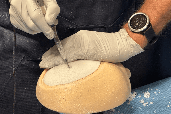 3D printed skull being drilled into