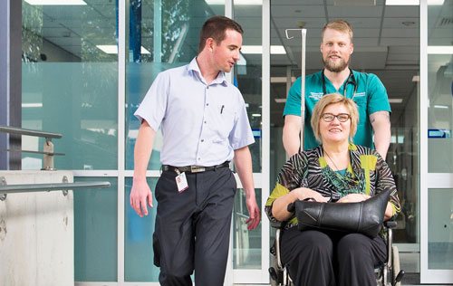 Patient leaving hospital in wheelchair