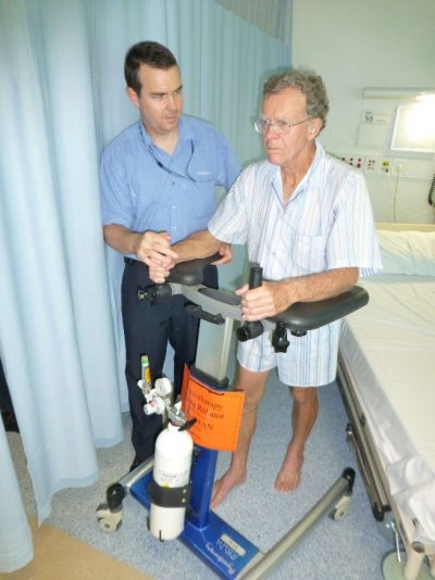 Patient using walking frame in hospital