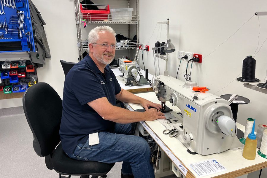 Alan working on an upholstery task at the Rehabilitation Engineering Centre at STARS.