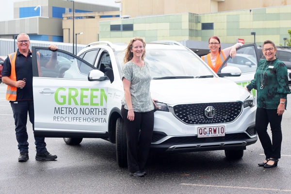 Metro North Health staff with Queensland Health’s first zero emissions vehicle