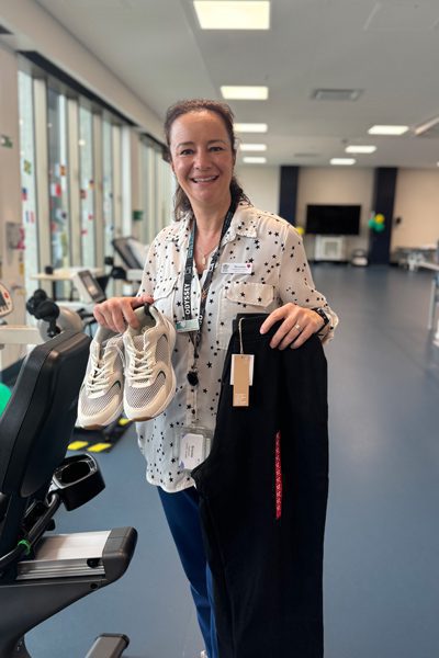 Brooke Wadsworth with some of the clothing items available in the 'Dignity at STARS' patient care initiative.