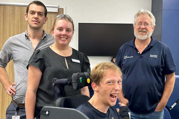 L-R - Will, Brooke and Alan from the Rehabilitation Engineering Centre with patient Christopher.