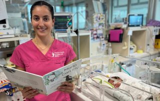 Nurse Bec reading to Lenny, showing RBWH's commitment to holistic care.