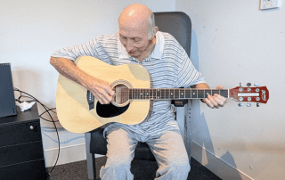 STARS Brain Injury Rehabilitation Unit patient Robert relearning his guitar skills