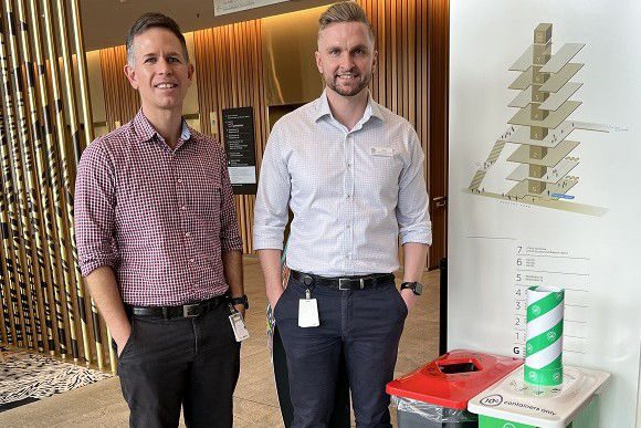 Mick Collins and Niel Verrall with the new Containers for Change bin at STARS.