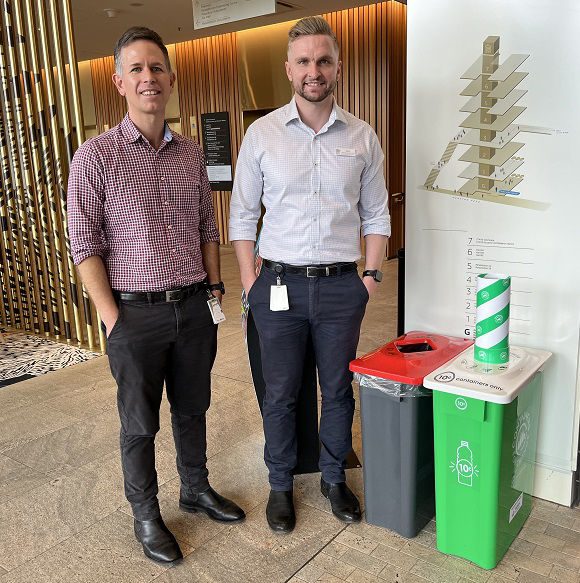 Mick Collins and Niel Verrall with the new Containers for Change bin at STARS.