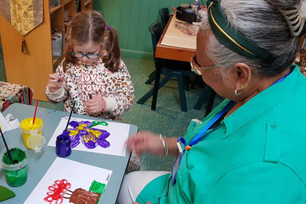 Grandfriends play with children at The Prince Charles Hospital Early Education Centre. 