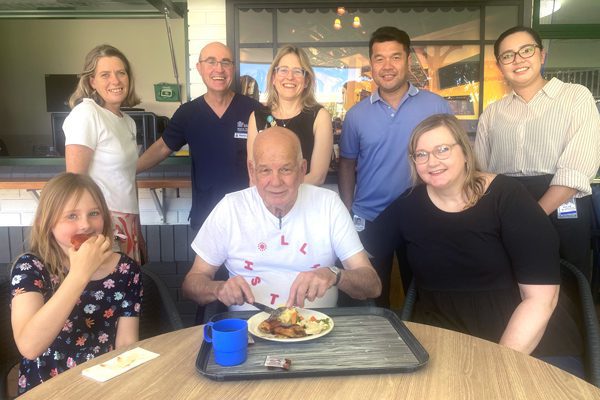 atient Neville Ross enjoys a meal with his daughter Michelle and granddaughter, Alexis at the new Charlies Village hotel accompanied by members of the CAM Unit team.