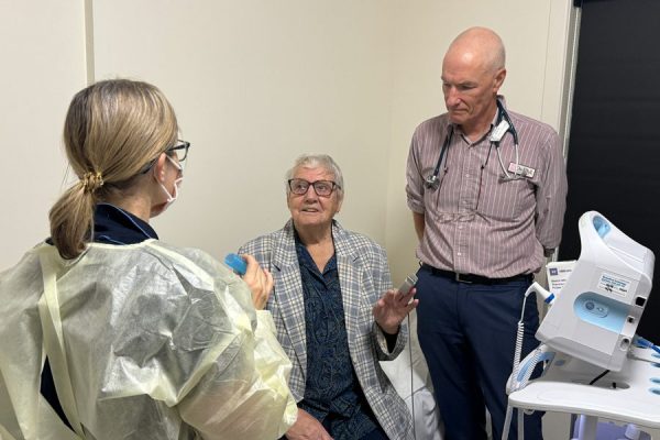 Respiratory physician Dr Phil Masel and the team with patient Pamela.