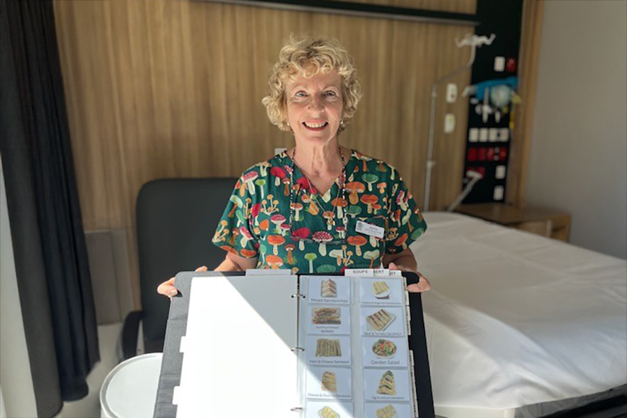 Interprofessional Clinical Assistant (IPCA) Jenny with some of the therapeutic meal ordering resources.