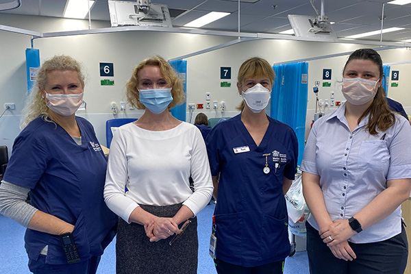 Four health professionals with masks