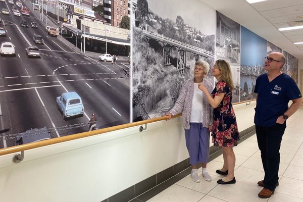 Patient Eileen takes a walk through Memory Lane with hospital staff members, Dr Lucy Dakin and Kevln Clark