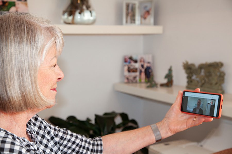 Woman looking a video on mobile phone