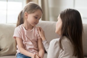 image of a sad child with parent