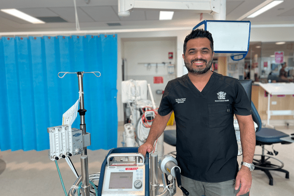 Professor Kiran Shekar standing in a hospital ward