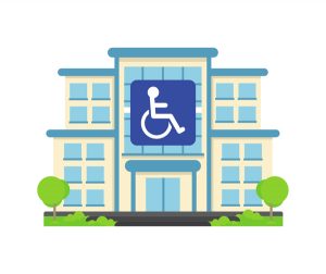 a hospital with a disabled sign in front of it