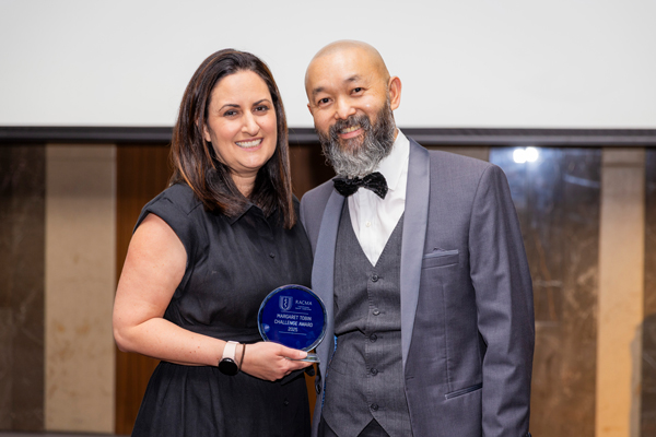 The Prince Charles Hospital Medical Administration Registrar Dr Jill Gardner accepts the Margaret Tobin Award from RACMA President Professor Erwin Loh.