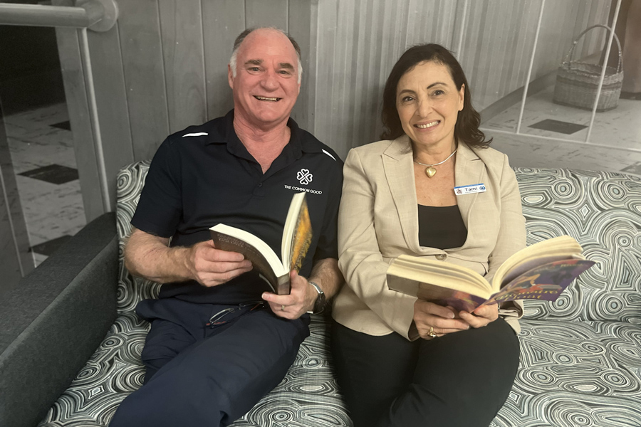 The Common Good Chief Executive Officer Steve Francia and The Prince Charles Hospital Executive Director Tami Photinos enjoy a good read at the Book Nook.