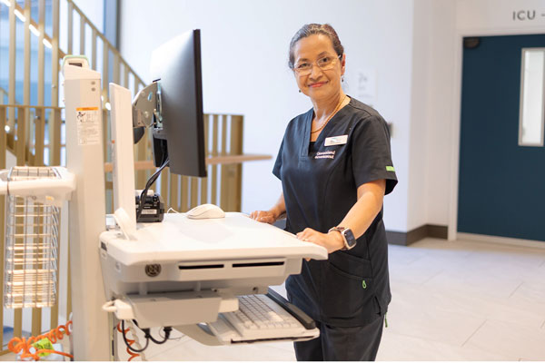 Caboolture Hospital staff member using the ieMR on a workstation on wheels