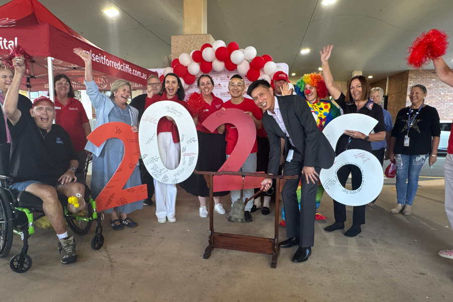 Redcliffe Hospital Executive Director Cang Dang rings the bell to celebrate $225,000 in community donations for Giving Day at Redcliffe Hospital.